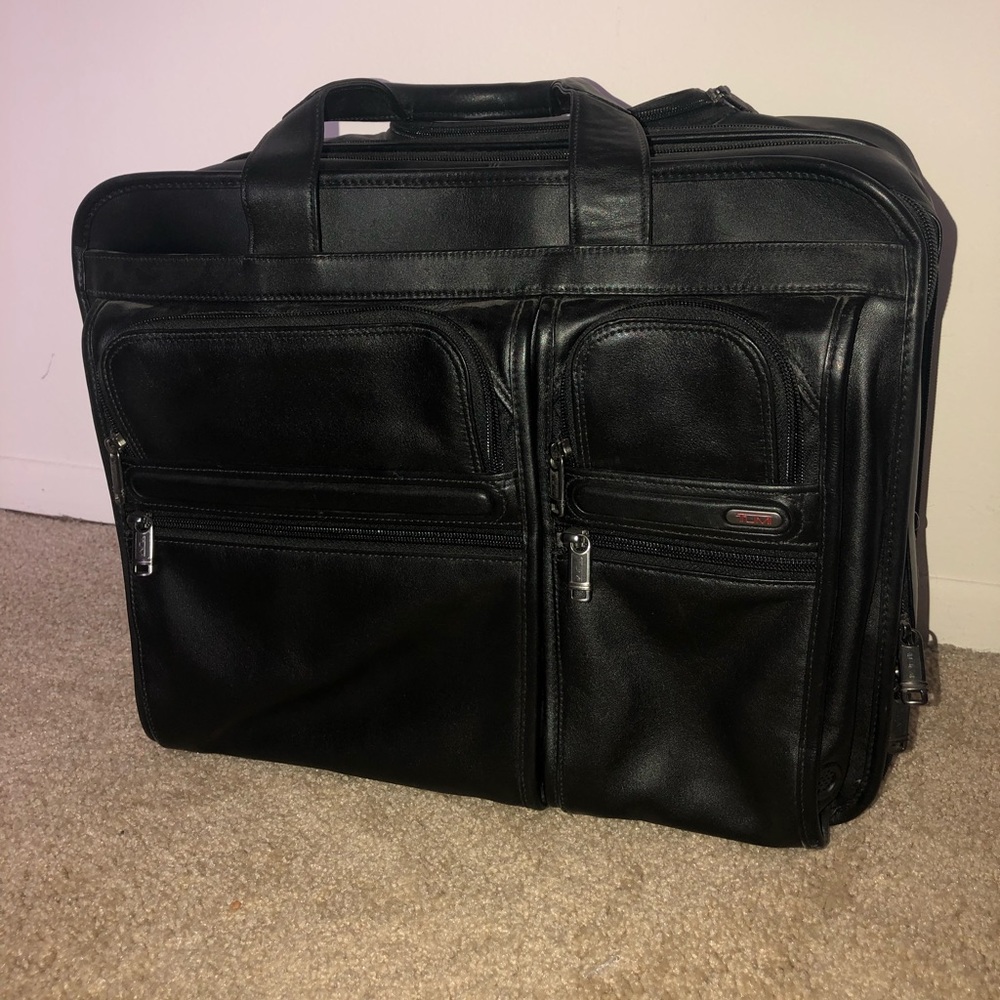 TUMILeather luggage bag carry-on.